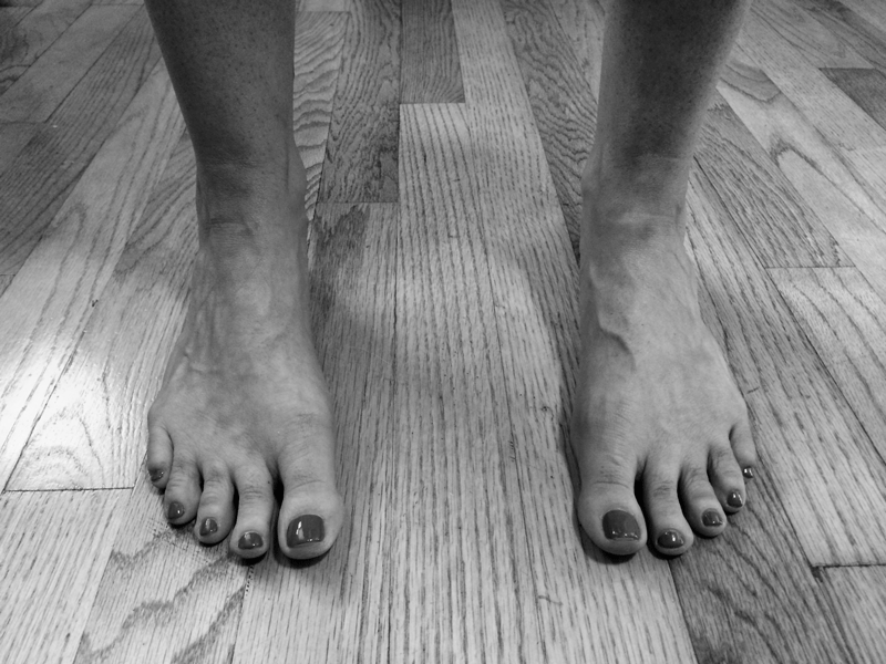 Stand with your feet in parallel to improve knee, hip, and lower back health.
